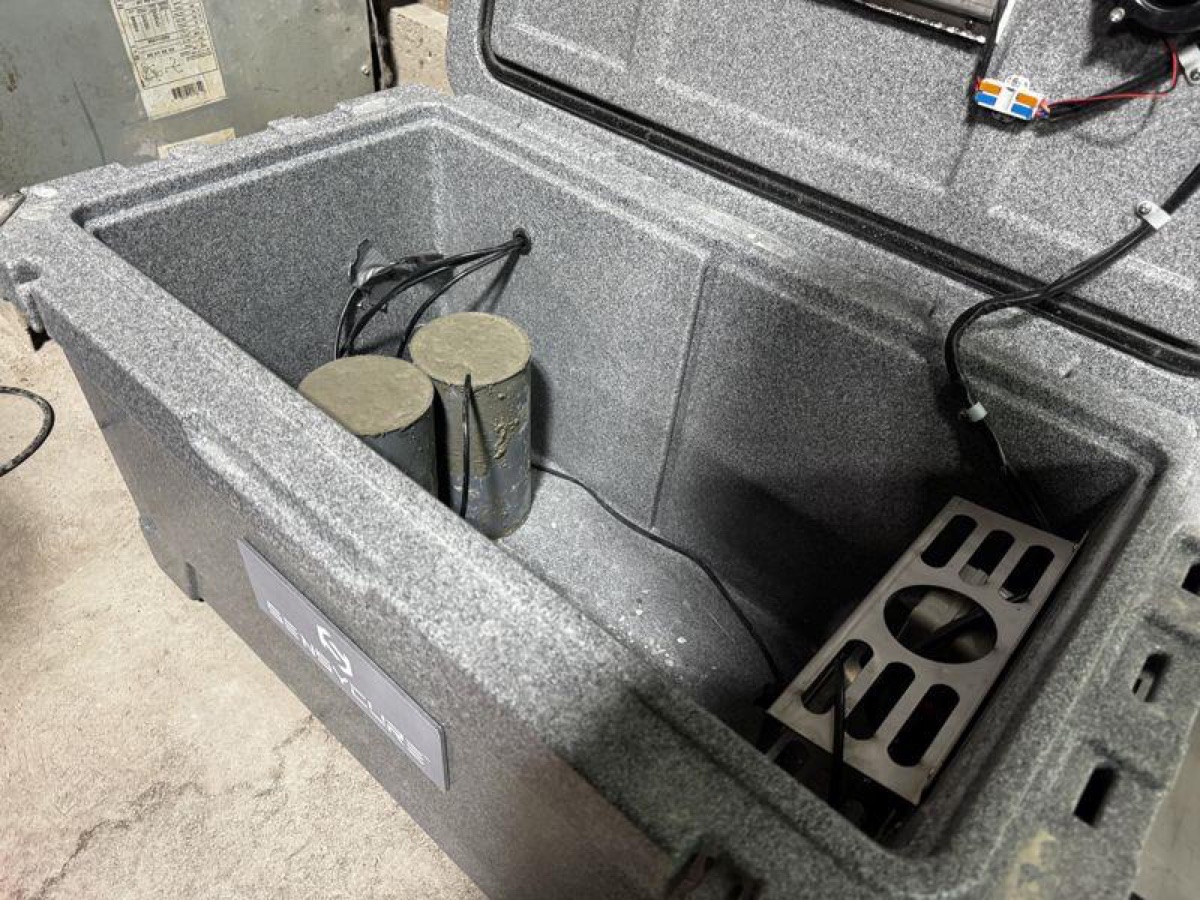 SensyCure match-cure chamber with two test cylinders inside during the trial