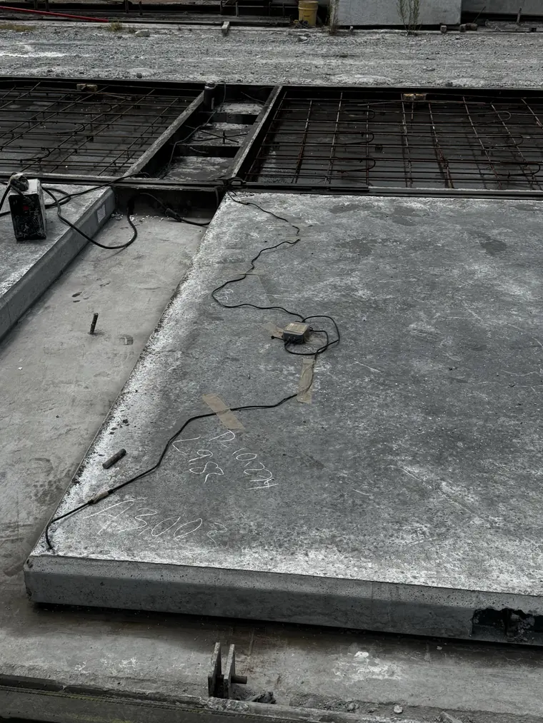 Sensytec sensor fixed to a cured precast panel at Concremex Monterrey, lead running to the casting bed