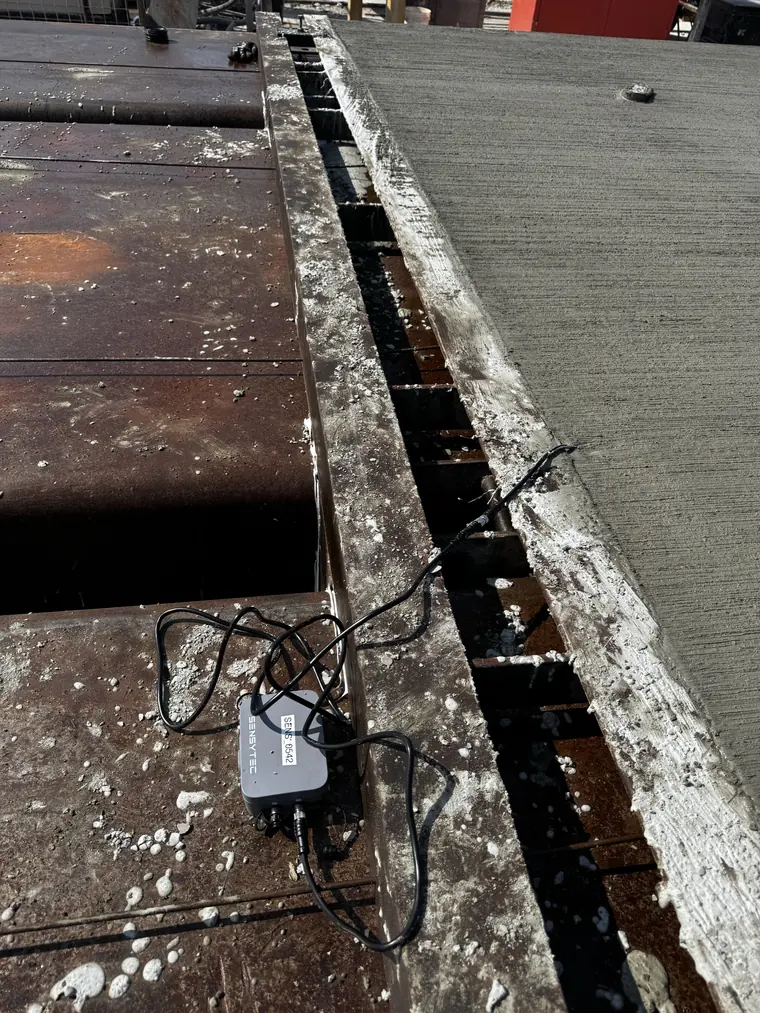 Sensytec SensyCast wireless sensor on the bed rail at NAPCO Precast, lead running into the cast element